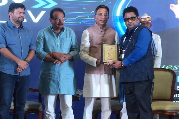 Rohit Jain on stage with other guests at the AI Future Ready Conclave in Agra, holding framed certificates.
