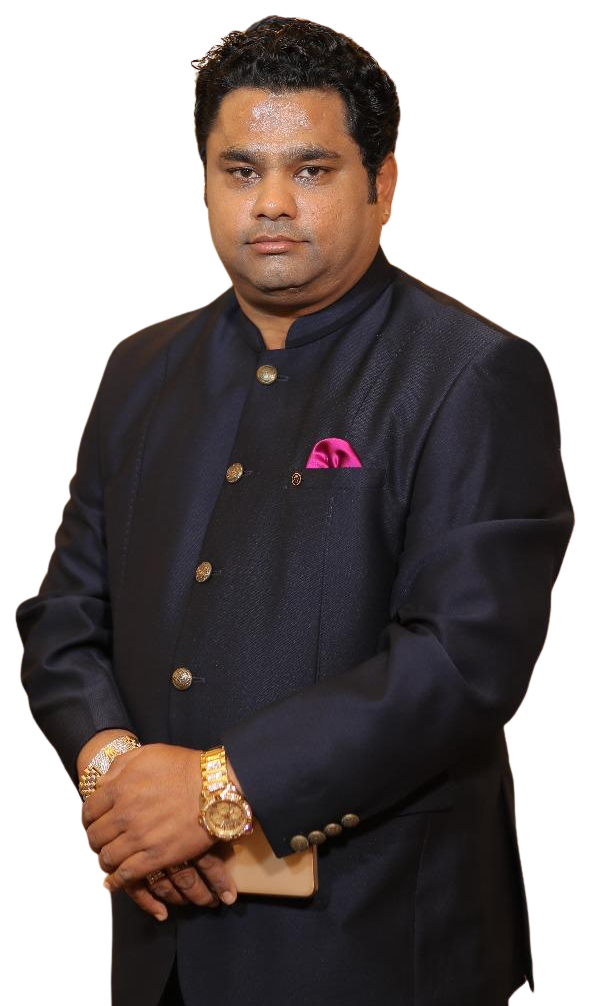 Rohit Jain, chairman of Ahinsa Group Agra, in a dark navy bandhgala with a pink pocket square, hands clasped in front of him.