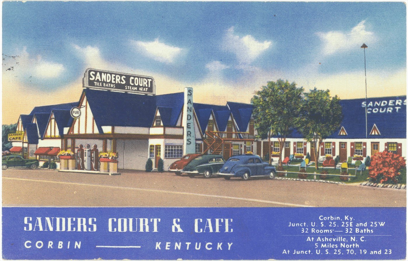A colour postcard of Sanders Court and Café, a low roadside motel and restaurant in Corbin, Kentucky, with cars parked outside.