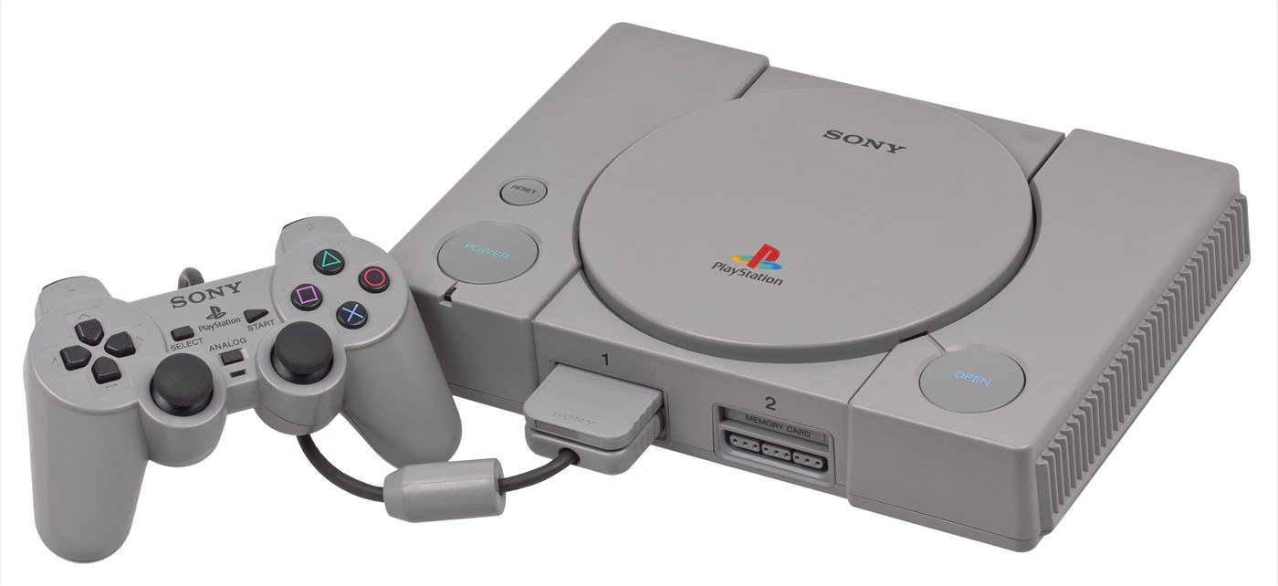 The original grey Sony PlayStation console with a DualShock controller and a memory card.