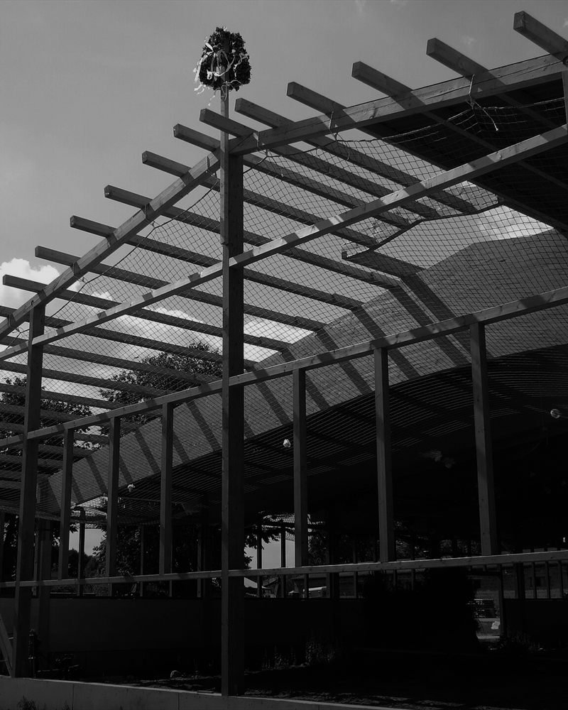 A timber roof structure under construction.