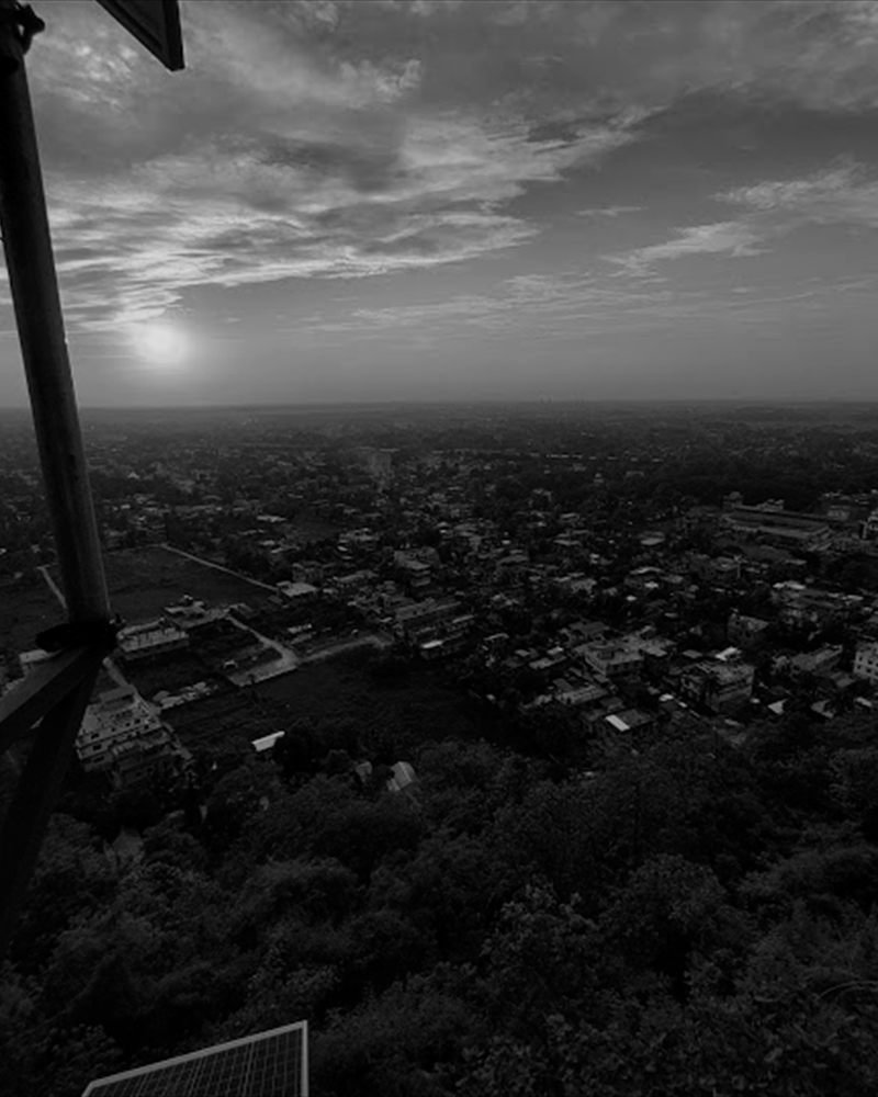 A city spread out under a low sun at dusk.