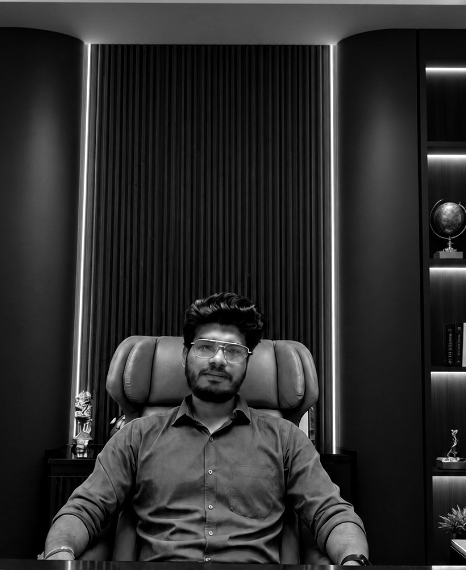 Pawan Chauhan, founder of 99Founder, seated at his desk in the Agra office.
